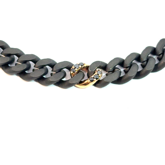Bracelet pour homme et femme en titane noir avec un maillon en or rose et diamants noirs. Bracelet Audace Anteo AUDACE6.1PN