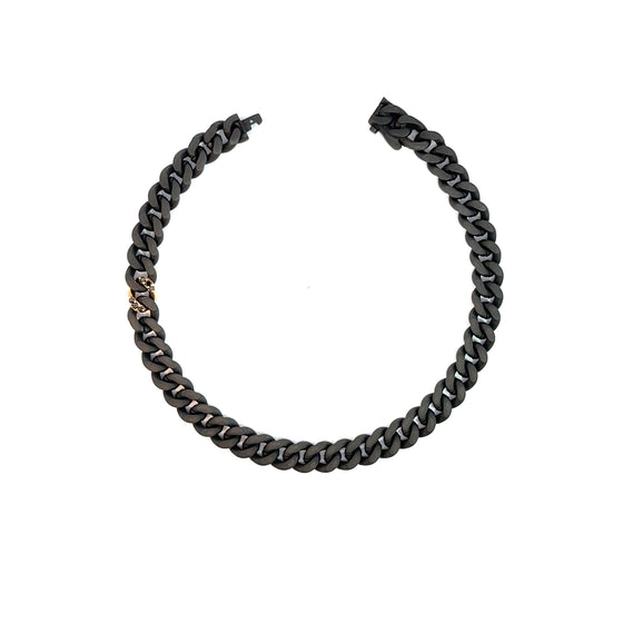 Bracelet pour homme et femme en titane noir avec un maillon en or rose et diamants noirs. Bracelet Audace Anteo AUDACE6.1PN