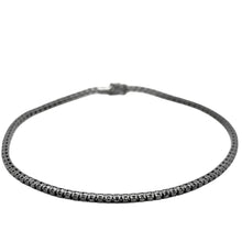  Bracelet tennis pour homme et femme en or blanc noirci et diamants noirs. Bracelet Tennis Michaud 141984