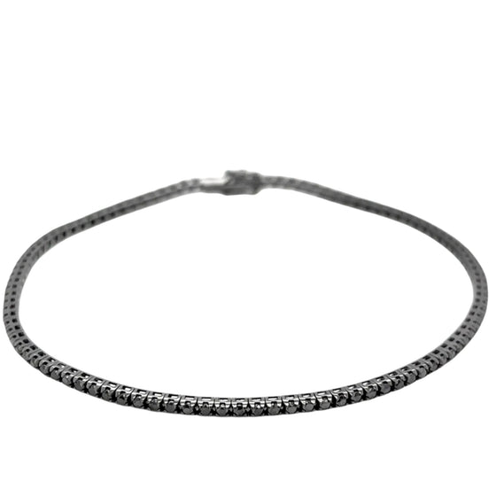 Bracelet tennis pour homme et femme en or blanc noirci et diamants noirs. Bracelet Tennis Michaud 141984