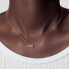 Move Uno necklace, mini model Move Uno bracelet in 18-karat rose gold, motif set with a moving brilliant-cut diamond in the center.