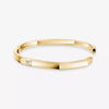 Moderniste bracelet, medium model Moderniste bracelet in 18-karat yellow gold, set with a brilliant-cut diamond. Mirror-polish finish on the outer surface.